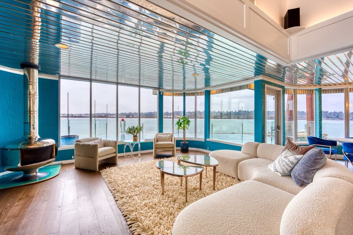 A waterfront living room with panoramic views in a luxury Portland vacation rental