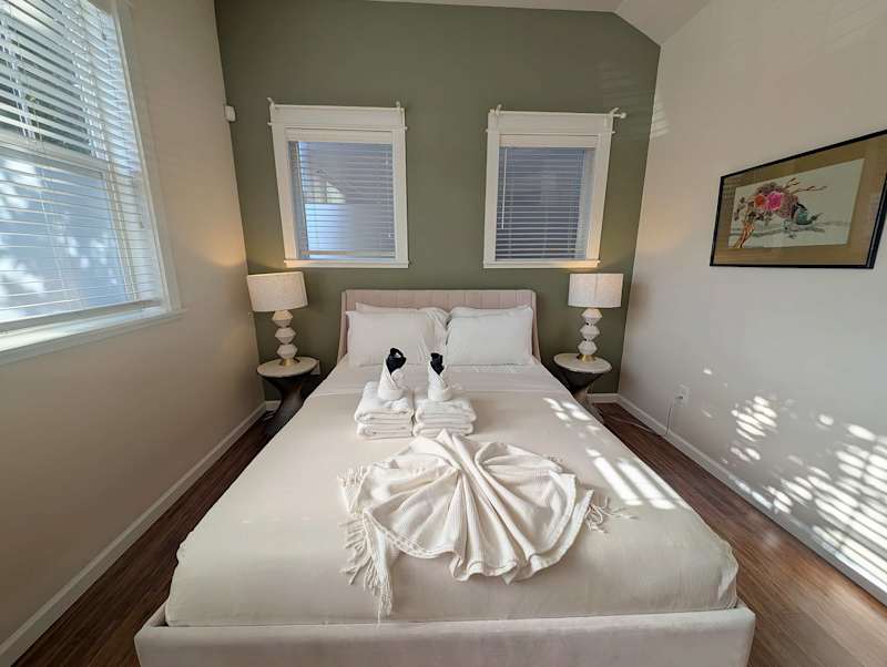 Vaulted-Ceiling Studio · Full Kitchen + Laundry